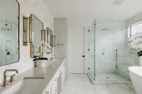 a bathroom with a bathtub and shower