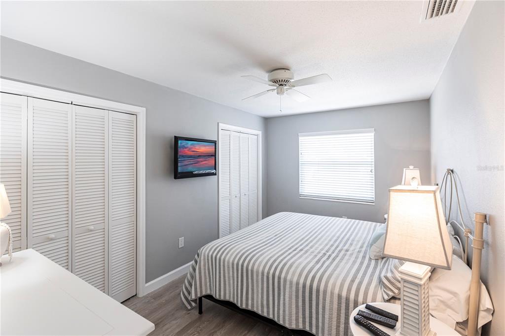 6020 Midnight Pass Road, Unit 11 Sarasota, FL 34242 - Photo 14 of 29 a bedroom with a bed and a window