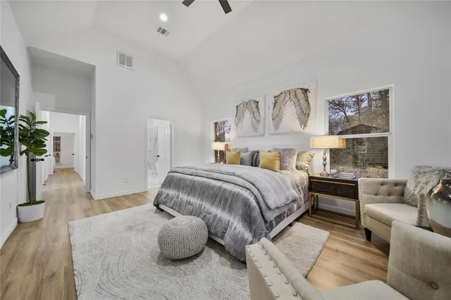 a bathroom with a double vanity sink toilet and shower