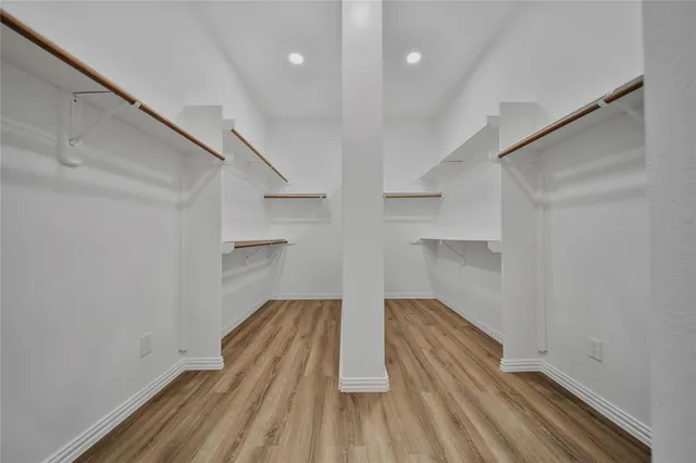 a bathroom with a sink vanity and mirror