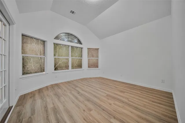 a bathroom with a sink vanity granite tub and shower