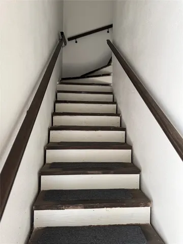 a bedroom with a bed and a mirror