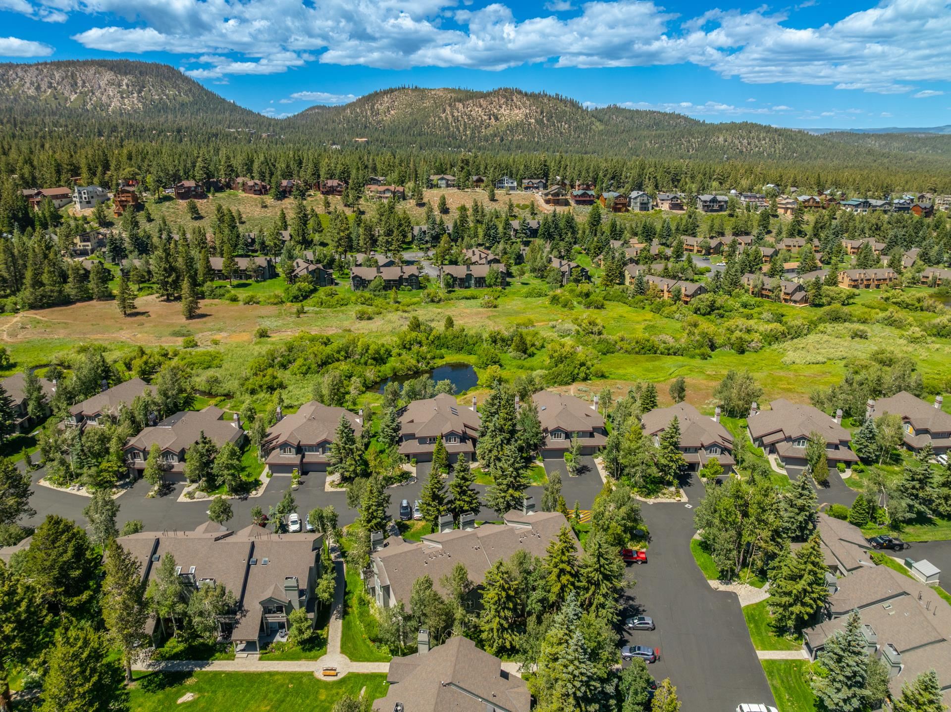 609 Golden Creek Road, Unit 609 Mammoth Lakes, CA 93546 - Photo 38 of 42 Aerial perspective showcasing multiple residential structures nestled among mature trees