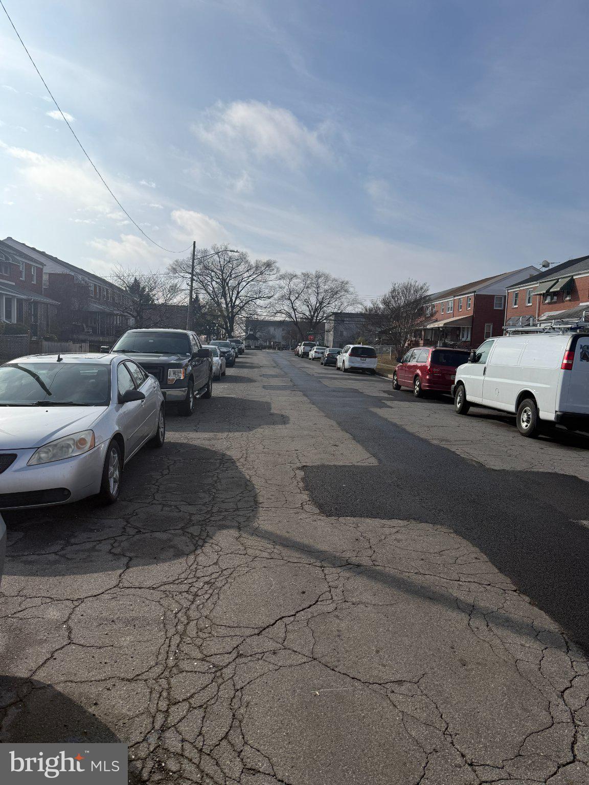 1907 Penhall Road Dundalk, MD 21222 - Photo 17 of 64 Quiet street lined with parked cars.