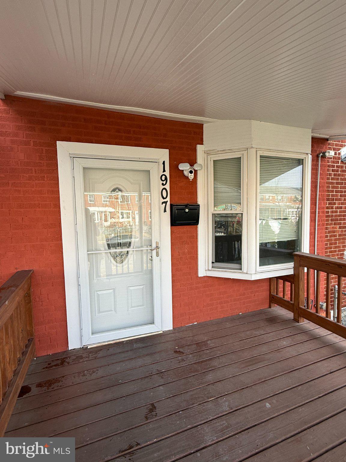 1907 Penhall Road Dundalk, MD 21222 - Photo 2 of 64 an empty room with wooden floor and windows