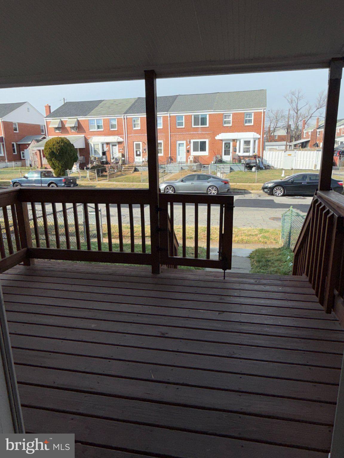 1907 Penhall Road Dundalk, MD 21222 - Photo 30 of 64 a view of a balcony with wooden floor