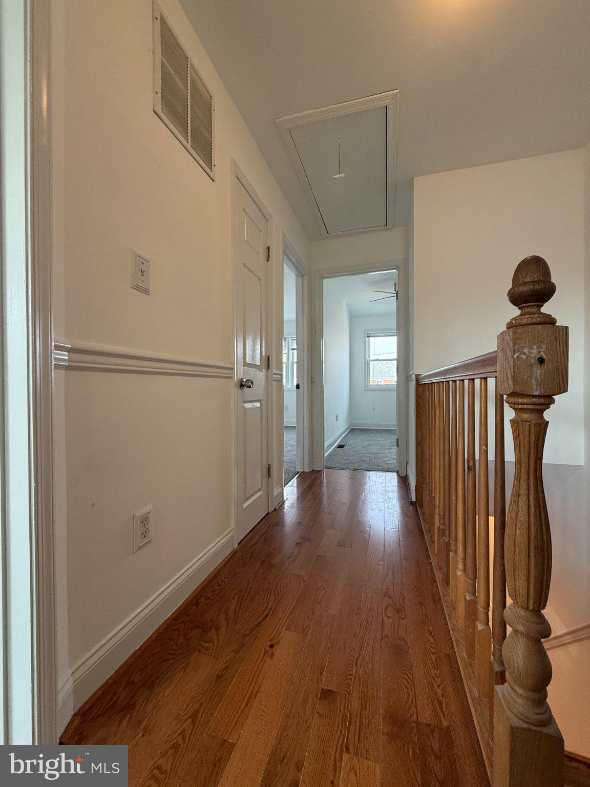 1907 Penhall Road Dundalk, MD 21222 - Photo 49 of 64 a view of a hallway with wooden floor
