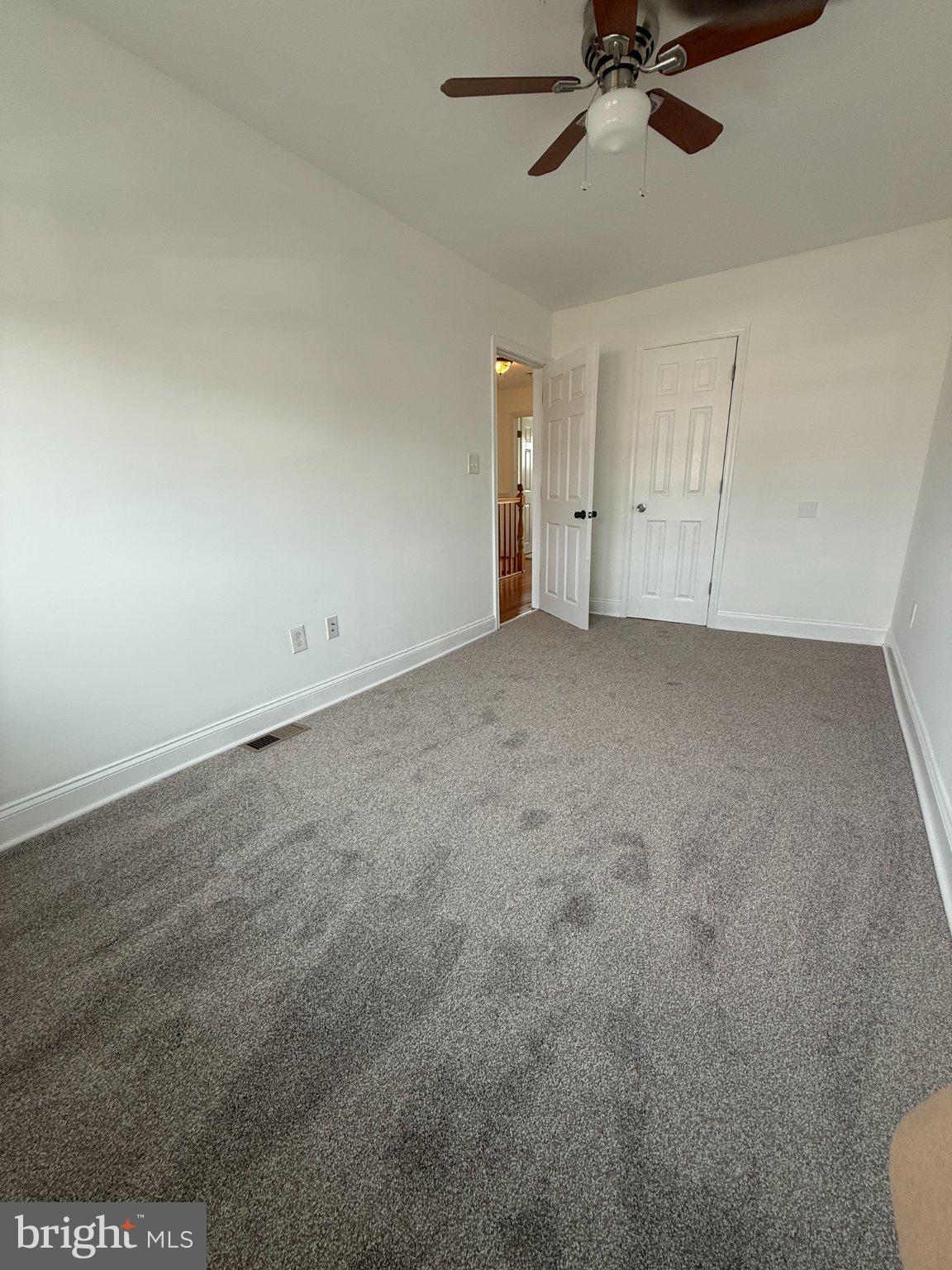 1907 Penhall Road Dundalk, MD 21222 - Photo 52 of 64 a view of an empty room and a ceiling fan