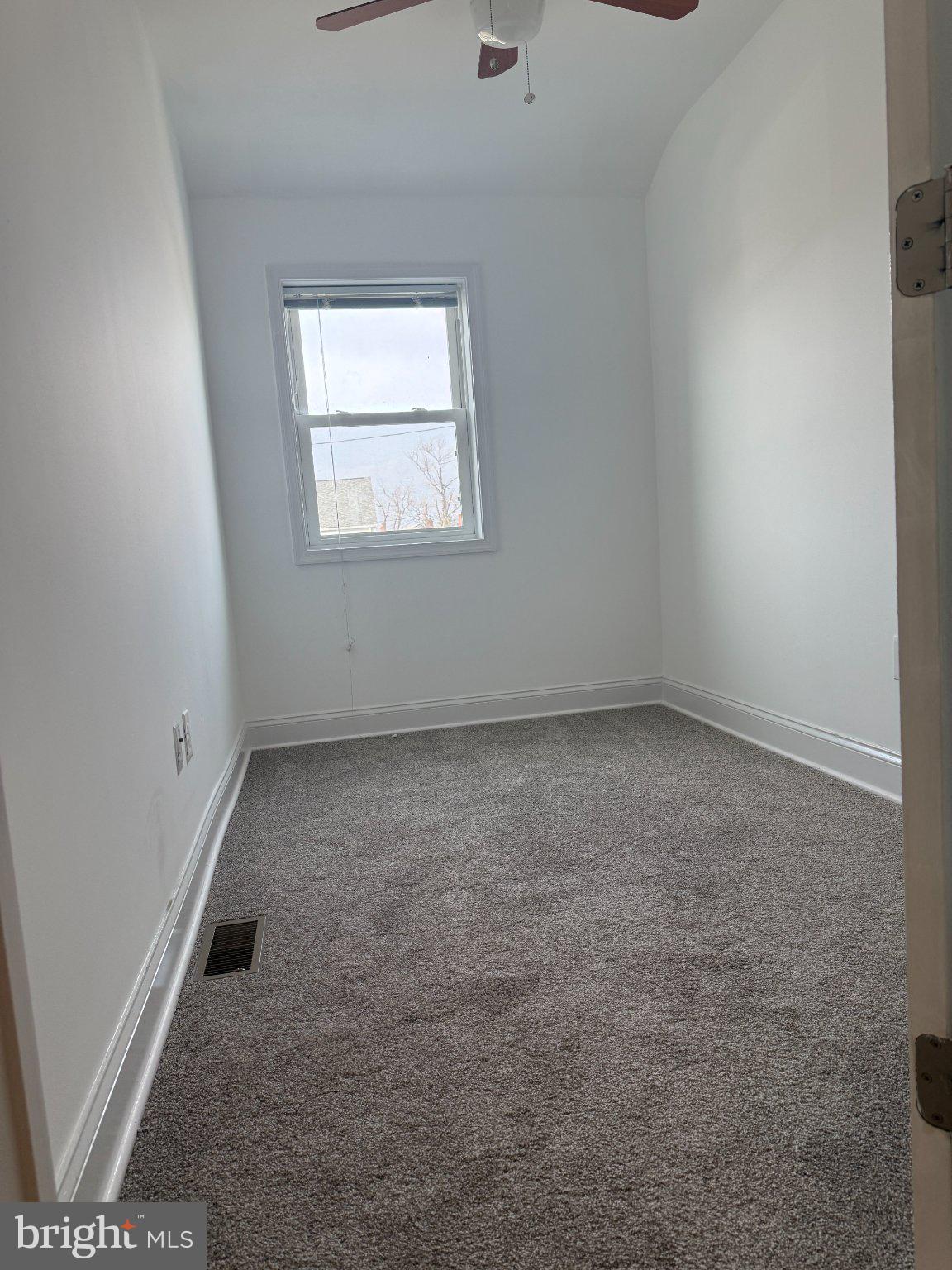 1907 Penhall Road Dundalk, MD 21222 - Photo 57 of 64 an empty room with a window