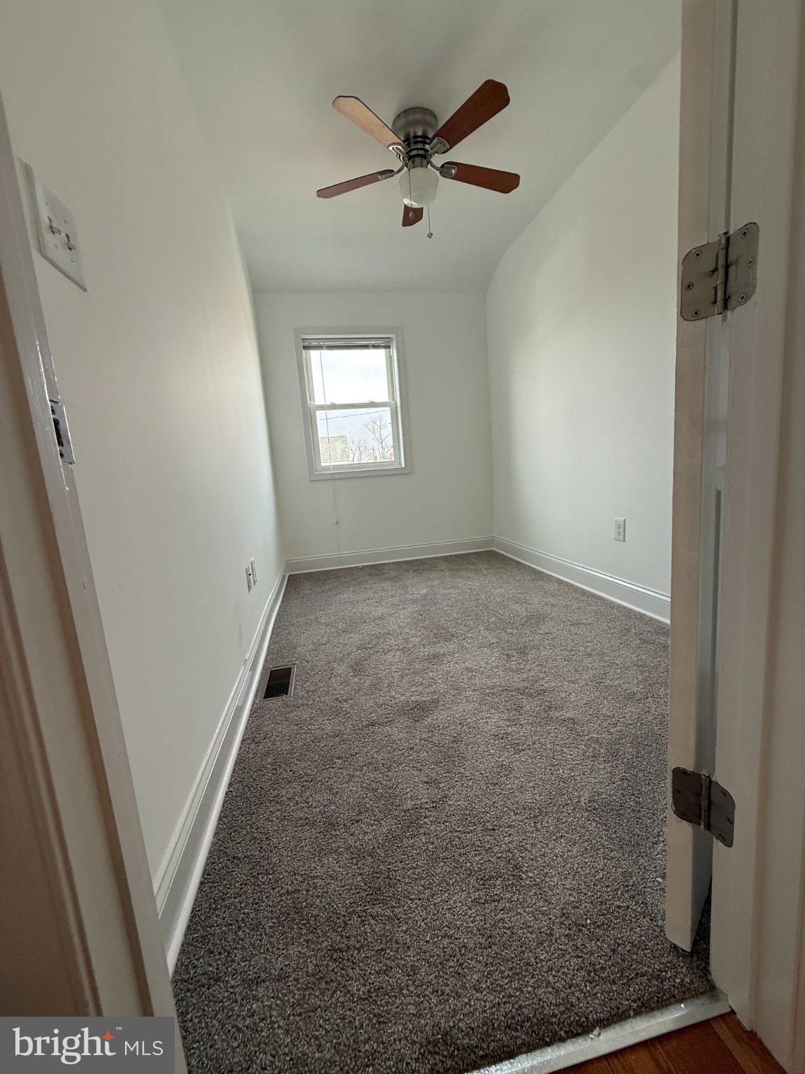 1907 Penhall Road Dundalk, MD 21222 - Photo 58 of 64 wooden floor in an empty room with a window