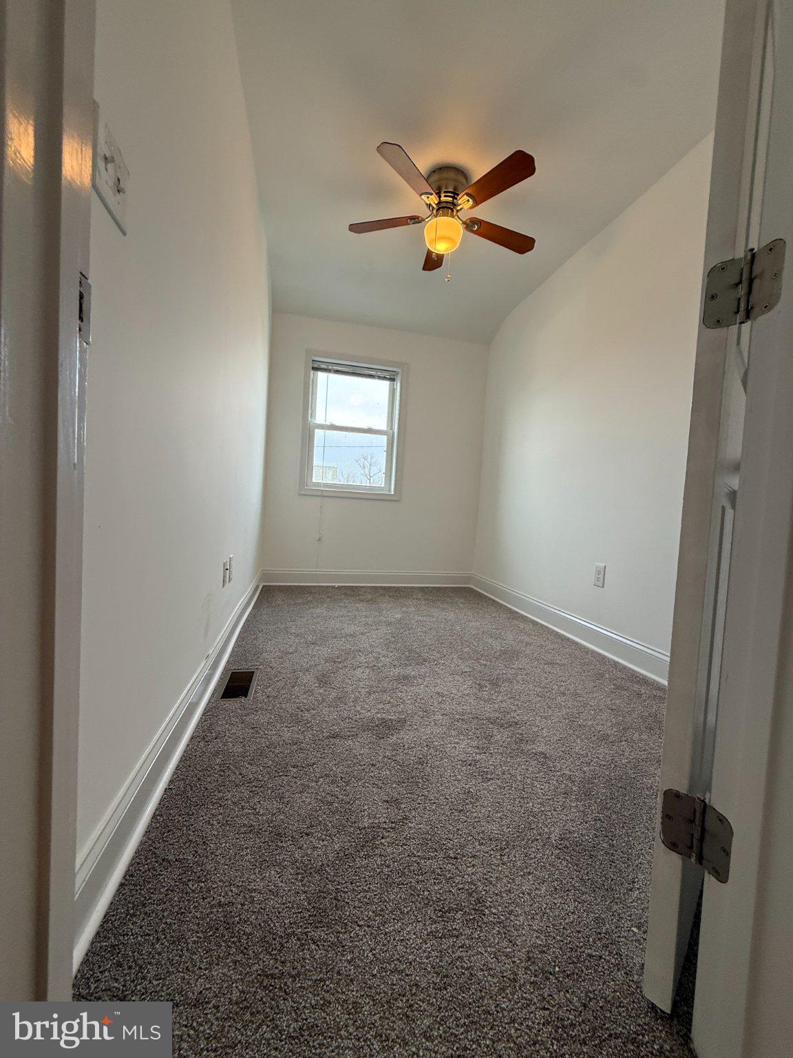 1907 Penhall Road Dundalk, MD 21222 - Photo 60 of 64 a view of room with a ceiling fan and window