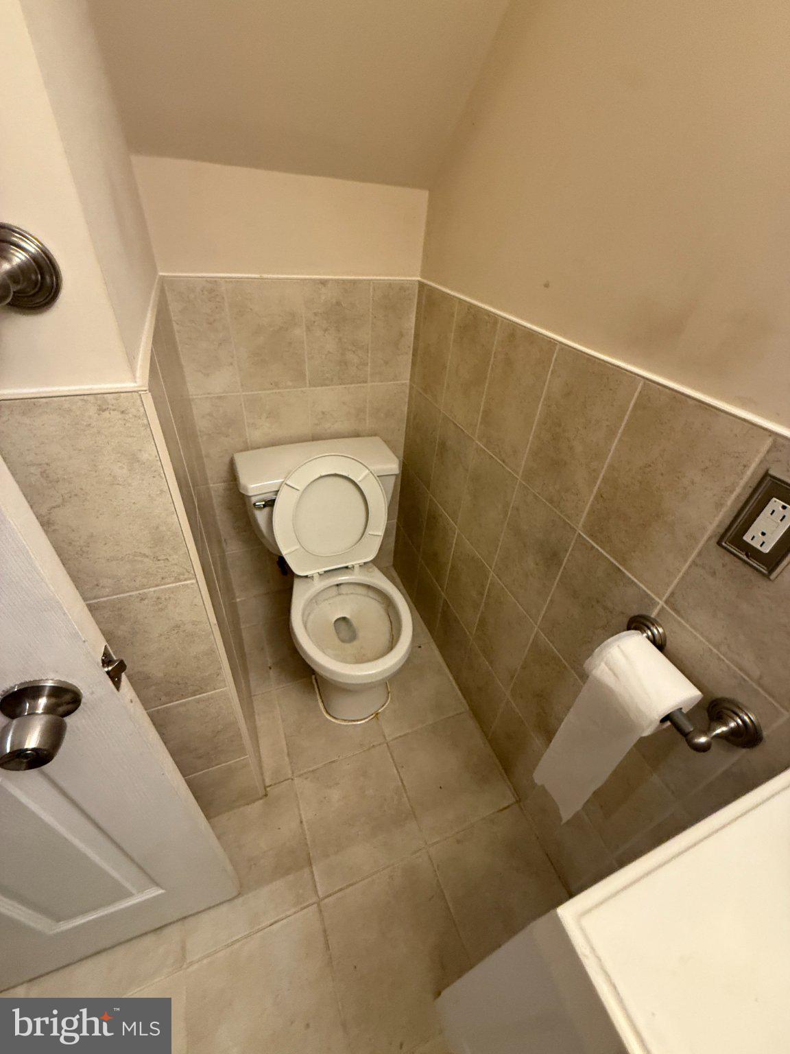1907 Penhall Road Dundalk, MD 21222 - Photo 6 of 64 a bathroom with a sink and a toilet
