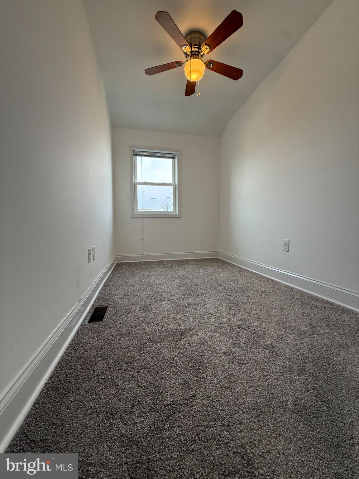1907 Penhall Road Dundalk, MD 21222 - Photo 61 of 64 an empty room with windows and fan