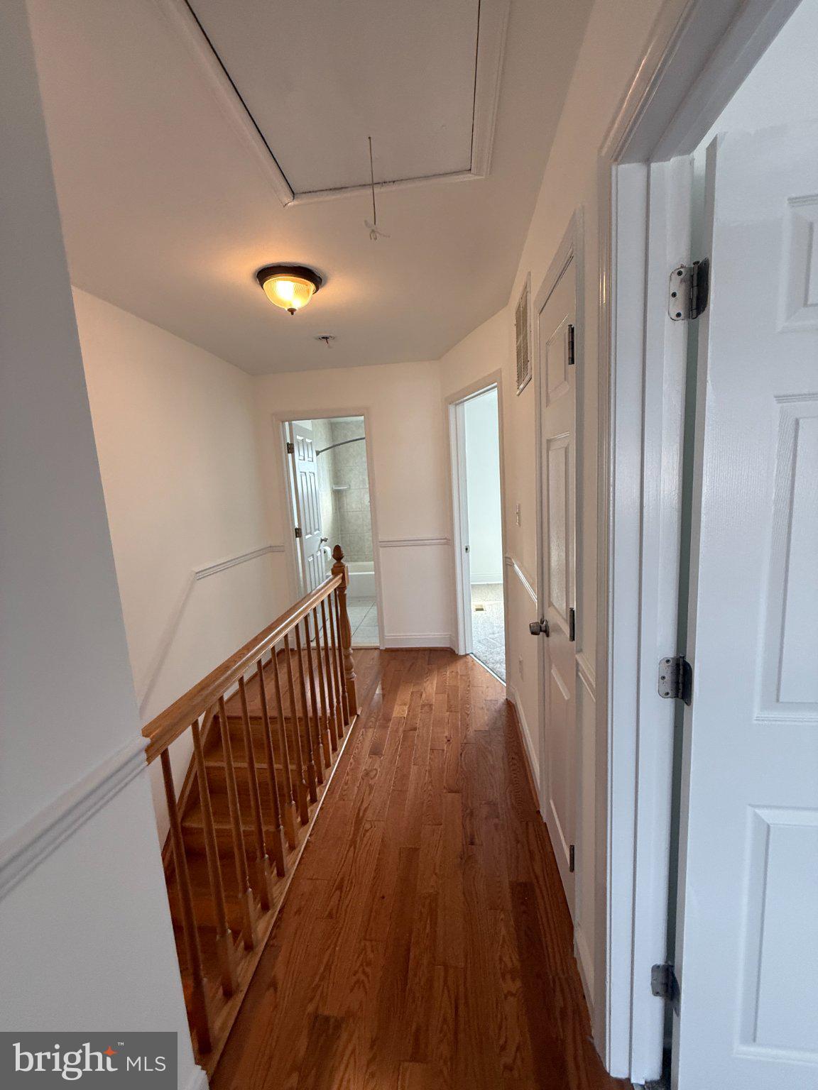 1907 Penhall Road Dundalk, MD 21222 - Photo 64 of 64 a view of a hallway with wooden floor and staircase