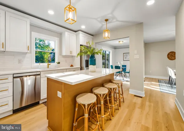 a open kitchen with stainless steel appliances granite countertop a stove and cabinets