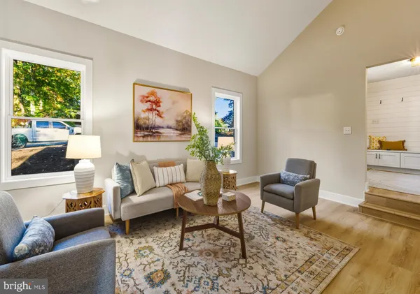 a living room with furniture and a rug