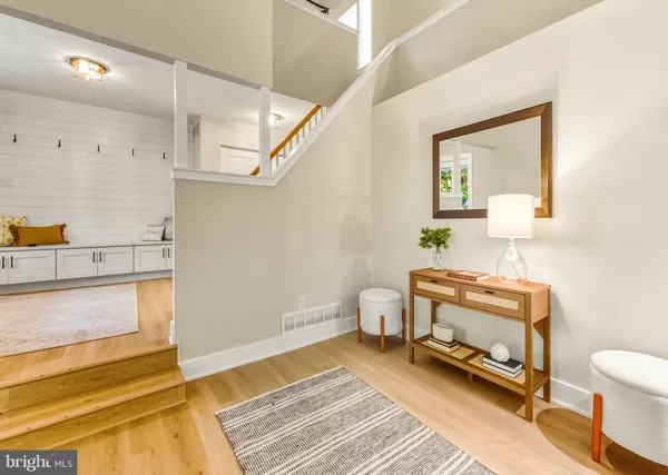 a spacious bathroom with a tub and toilet