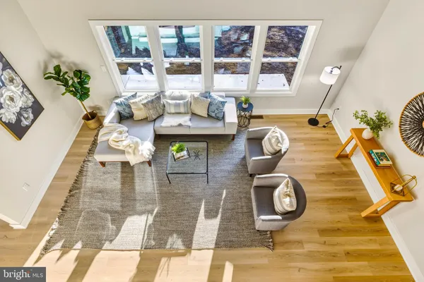 a view of living room with furniture and floor to ceiling window