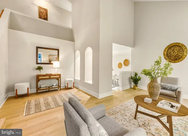 a living room with furniture and a table