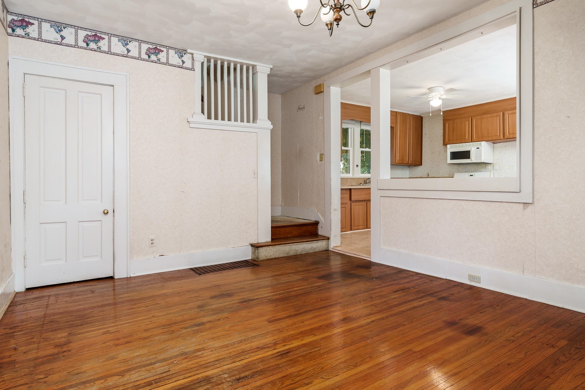 305 West 3rd Street Byron, IL 61010 - Photo 13 of 37 a view of empty room with wooden floor and fan