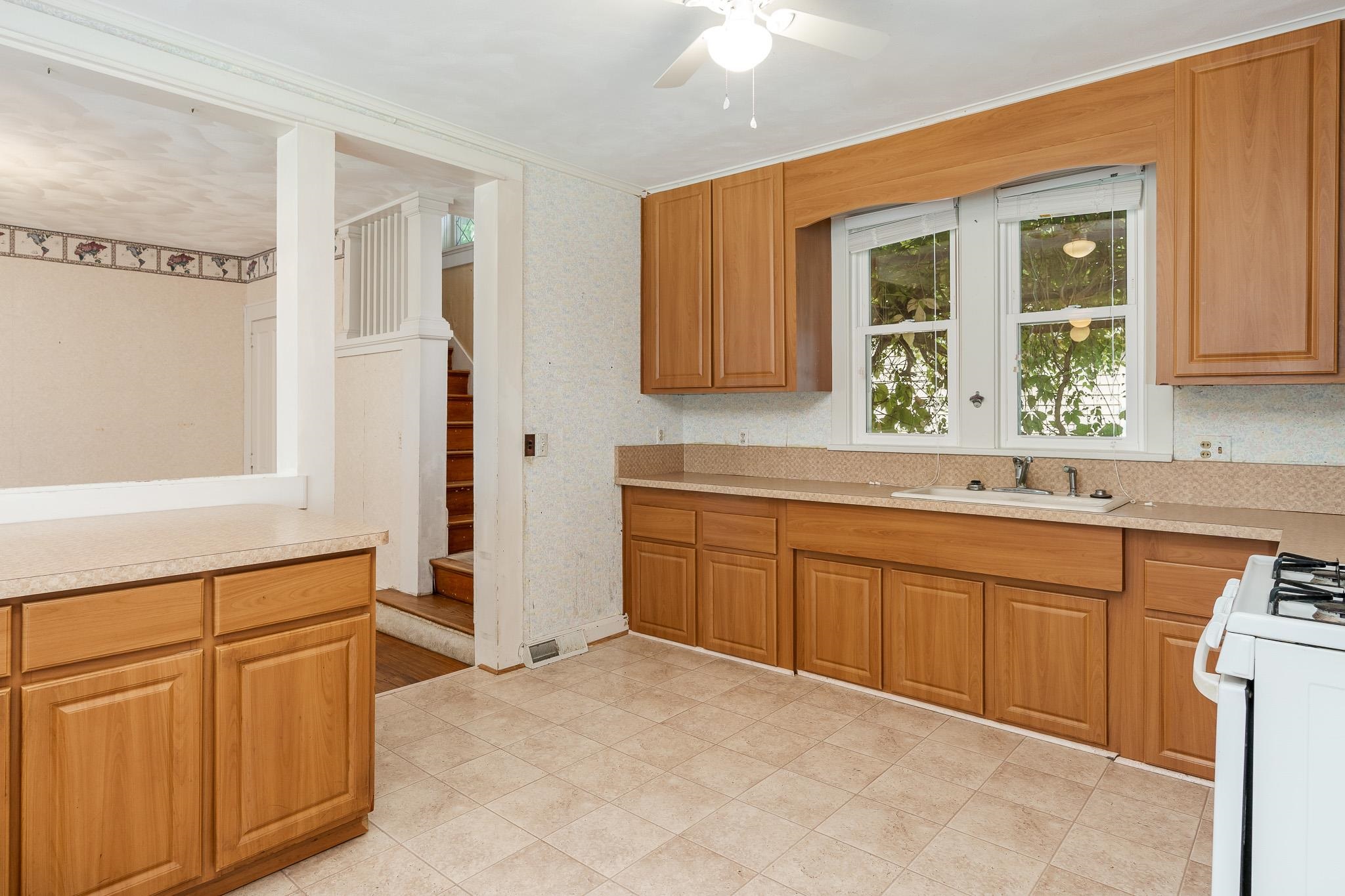 305 West 3rd Street Byron, IL 61010 - Photo 20 of 37 a spacious bathroom with a granite countertop sink and a mirror