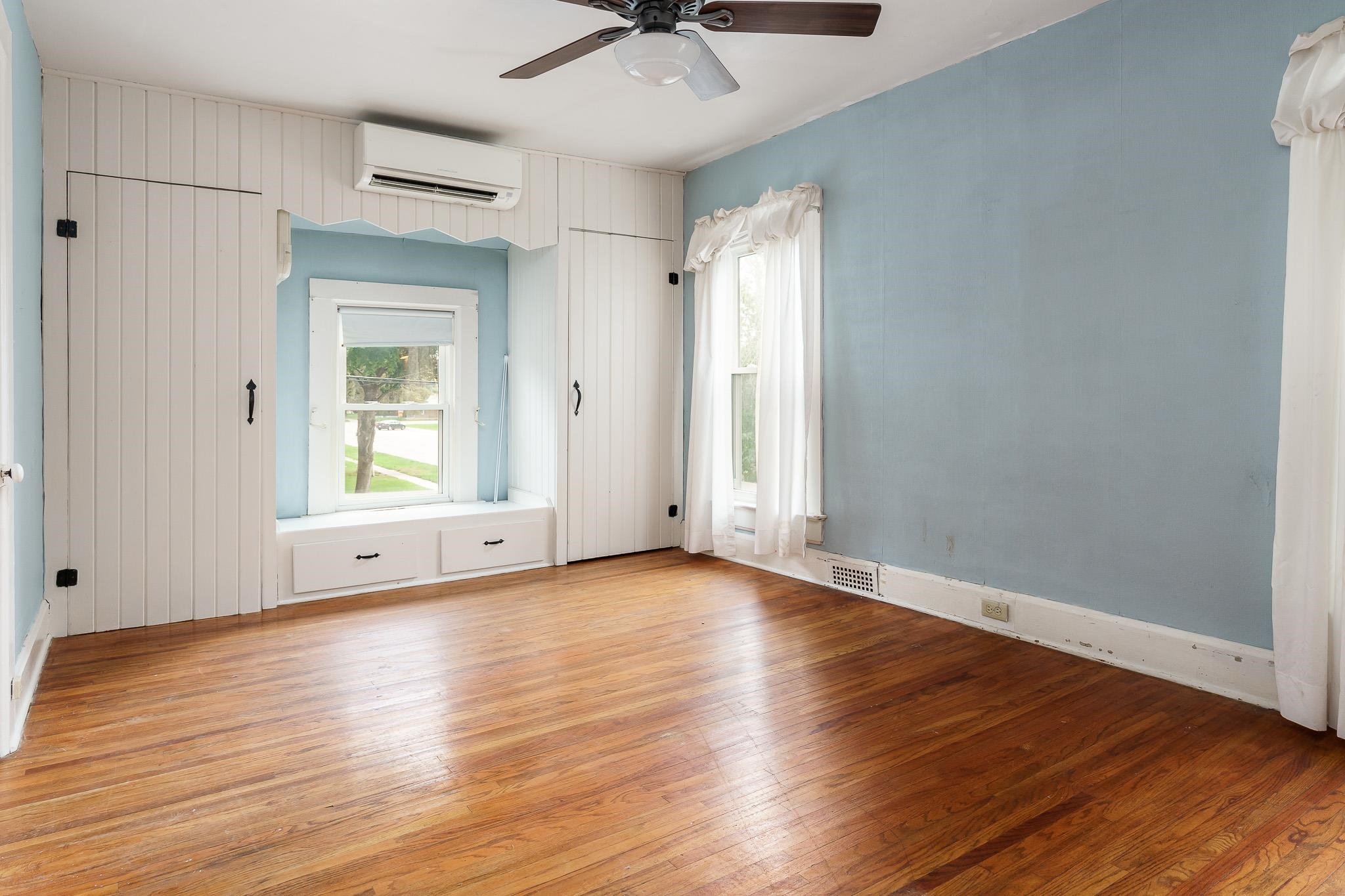 305 West 3rd Street Byron, IL 61010 - Photo 25 of 37 a view of an empty room with window and wooden floor