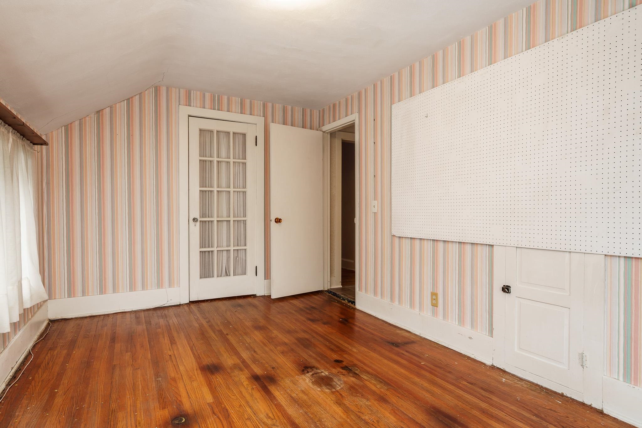 305 West 3rd Street Byron, IL 61010 - Photo 30 of 37 a view of an empty room with wooden floor