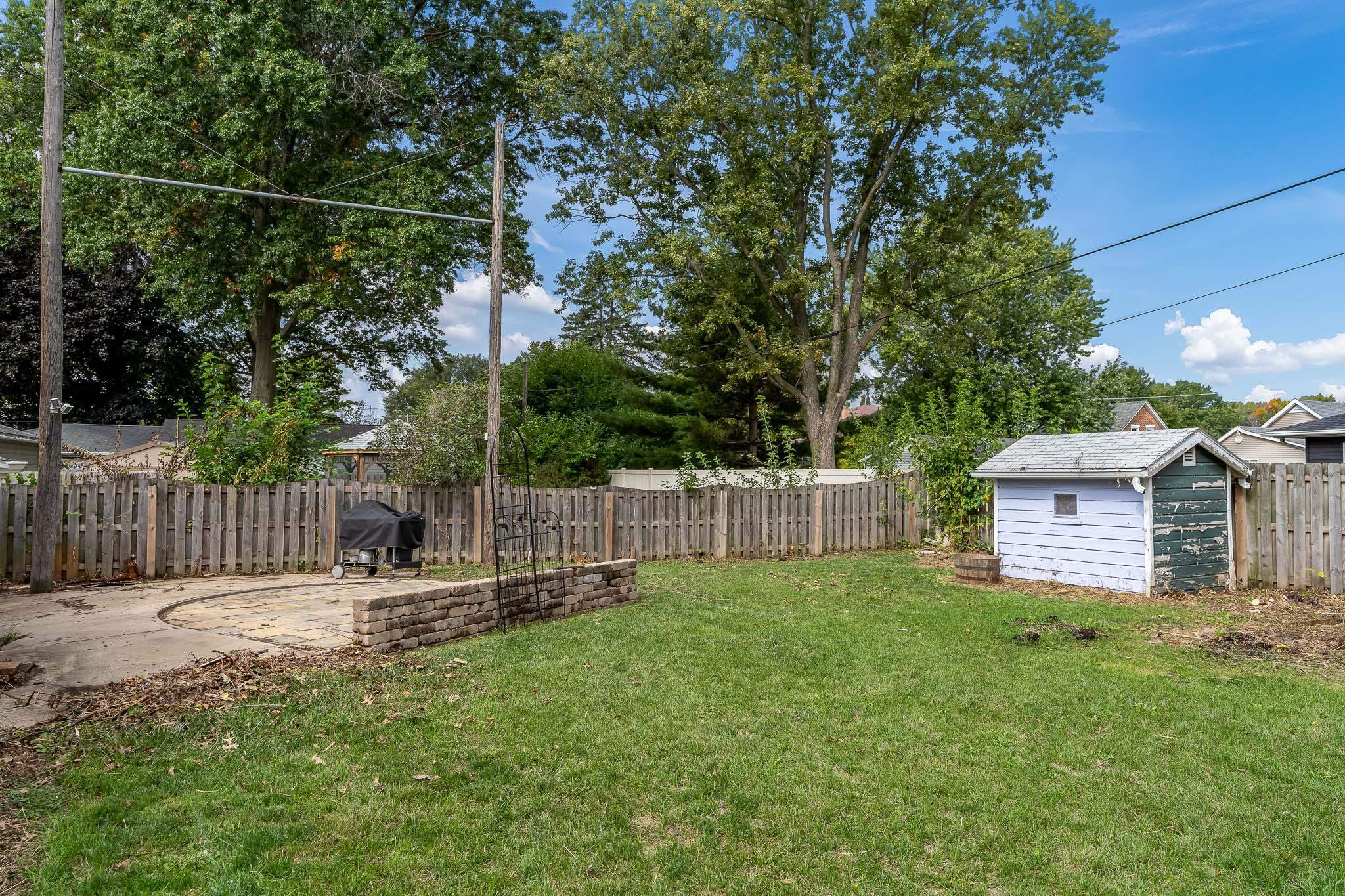 305 West 3rd Street Byron, IL 61010 - Photo 37 of 37 a garden with wooden fence