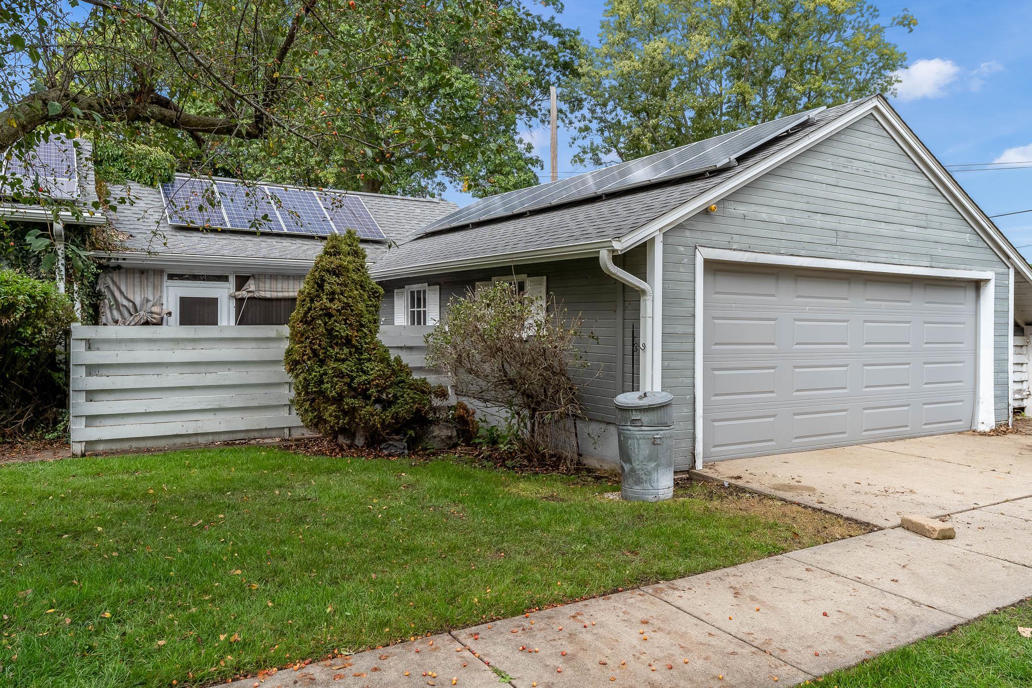 305 West 3rd Street Byron, IL 61010 - Photo 5 of 37 a view of a small house with a yard