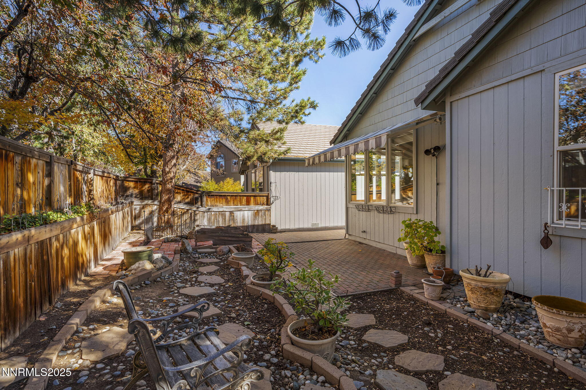 825 Caughlin Crossing, Unit CAUGHLIN RANCH PKWY Reno, NV 89519 - Photo 24 of 35 a view of a house with a yard