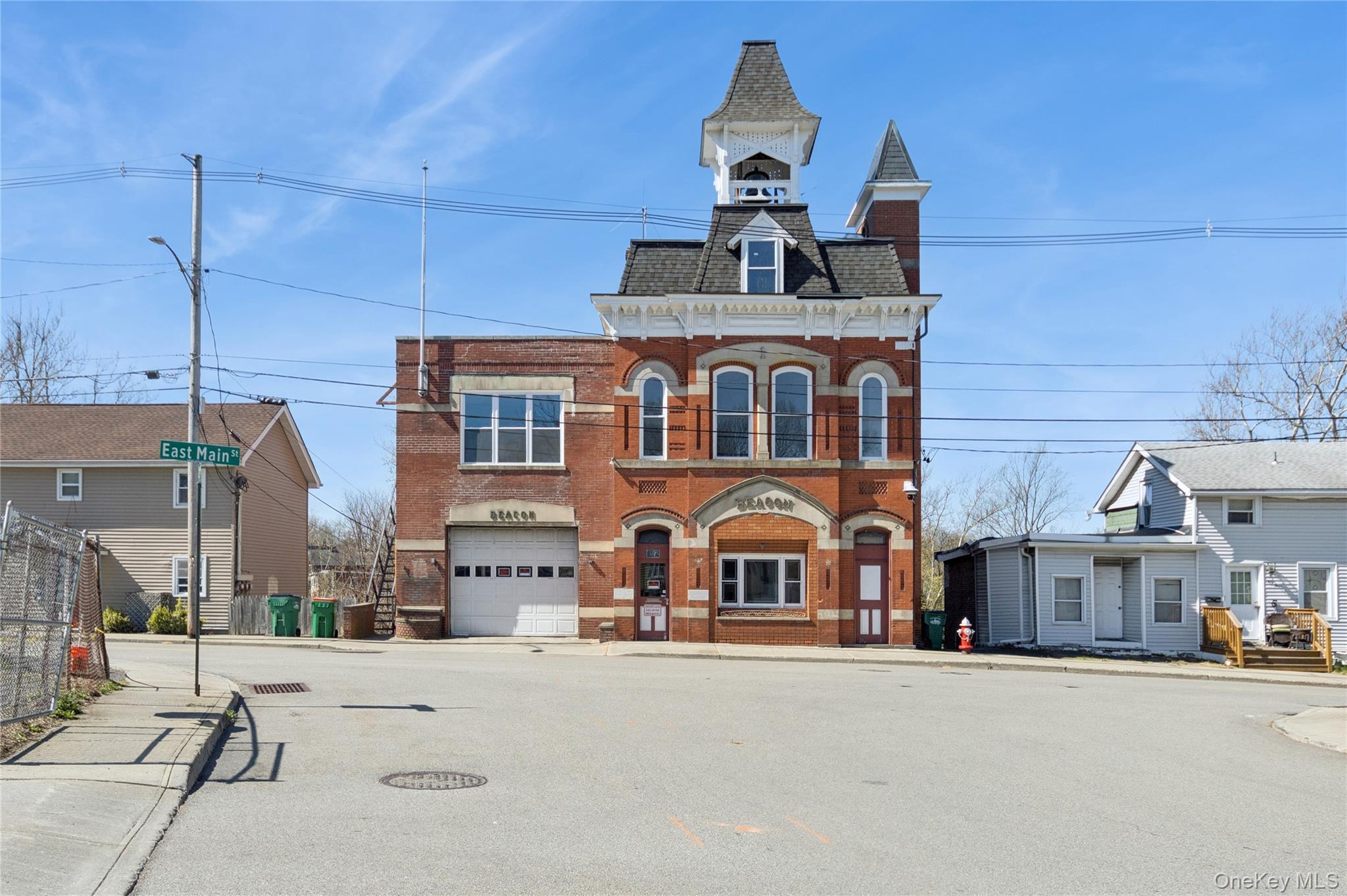 57 East Main Street Beacon, NY 12508 - Photo 2 of 48 a front view of a building with streets and trees