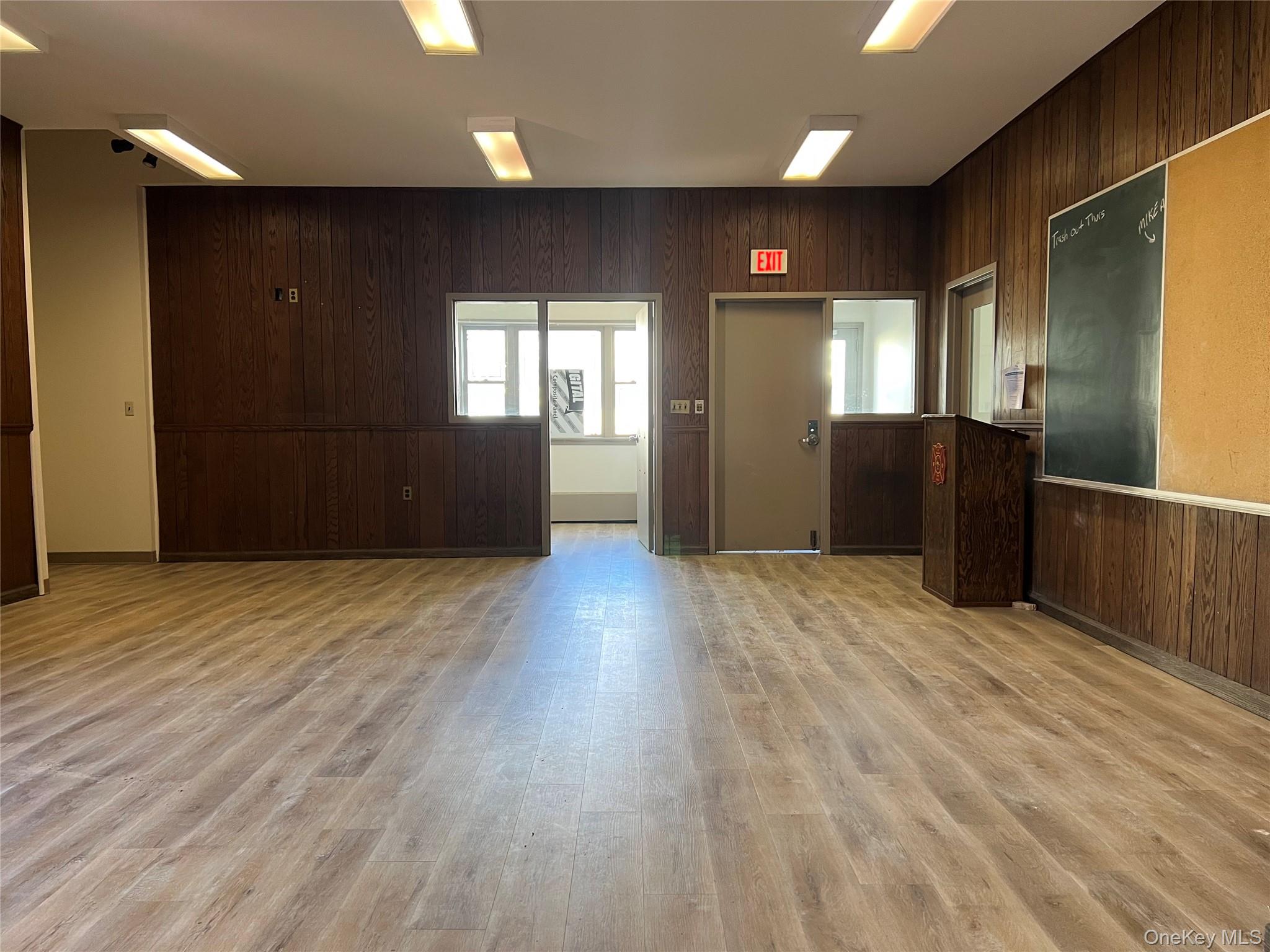 57 East Main Street Beacon, NY 12508 - Photo 25 of 48 a view of an empty room with wooden floor and a window