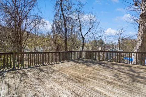 a view of a terrace with a table and chairs