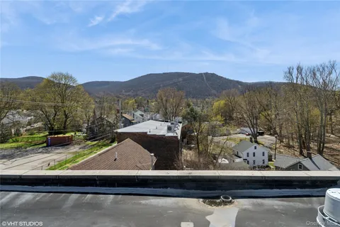 a view of a fireplace with two windows