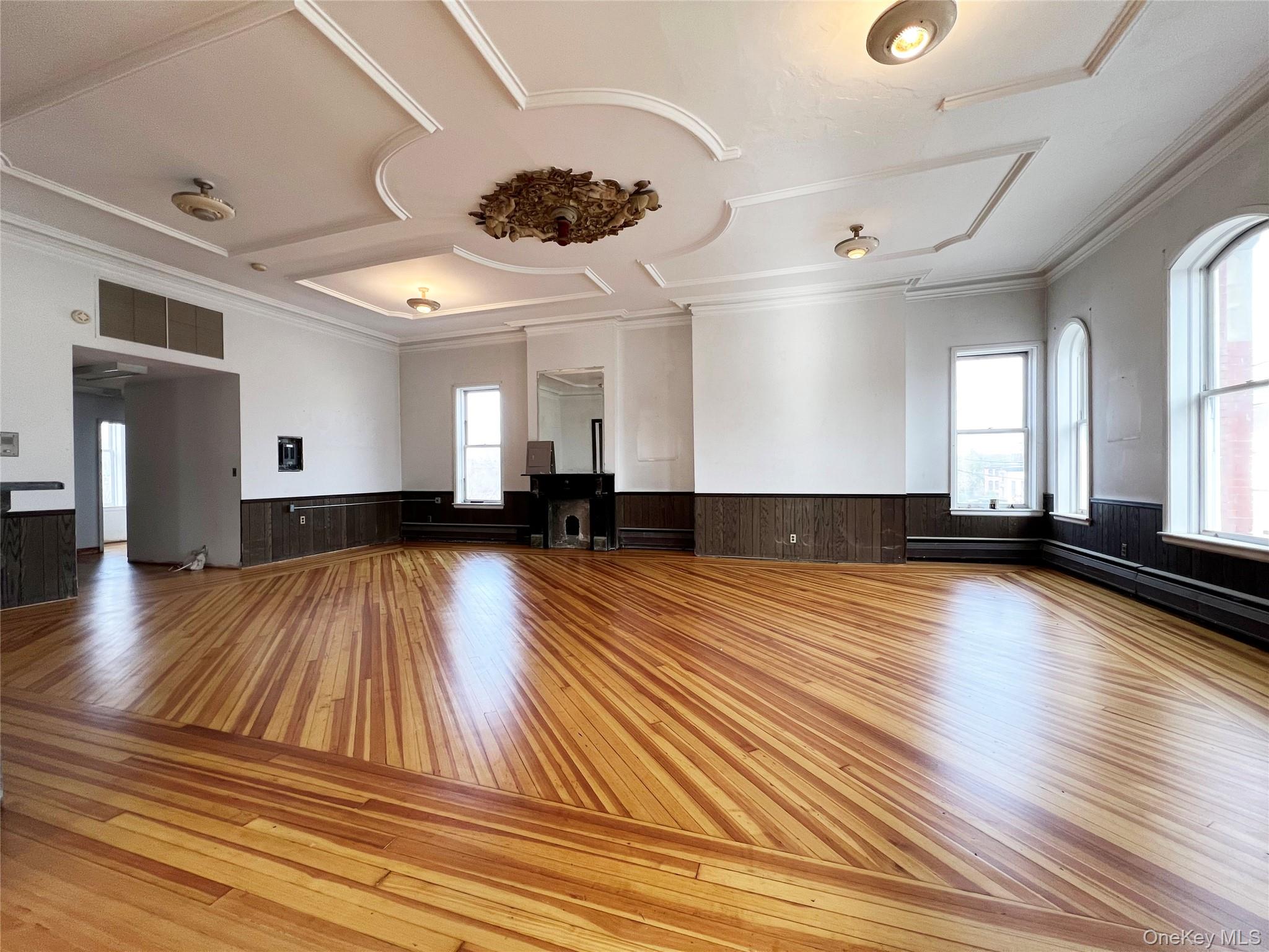 57 East Main Street Beacon, NY 12508 - Photo 5 of 48 a view of a room with wooden floors and lots of windows