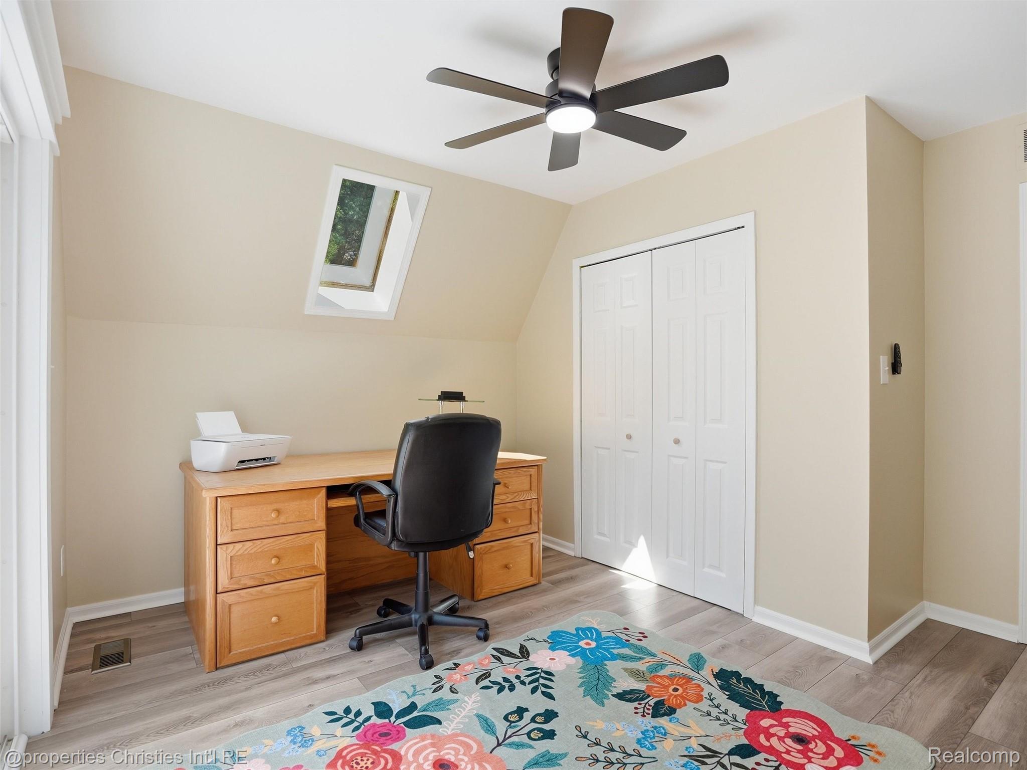 8645 Toma Road Pinckney, MI 48169 - Photo 29 of 65 Bedroom with skylight, ceiling fan, laminate flooring