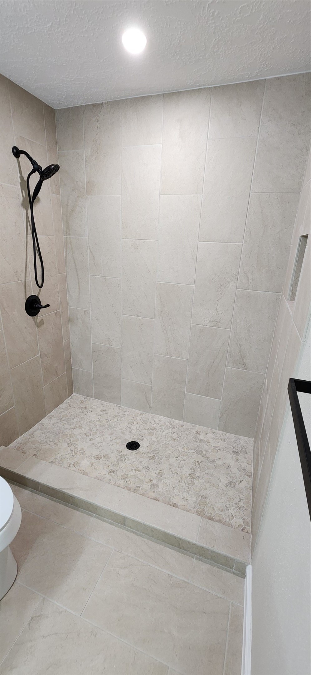 128 Lasso Street Angleton, TX 77515 - Photo 19 of 30 a bathroom with a shower