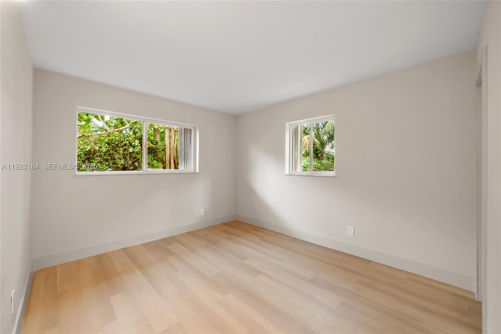 2350 Northwest 56th Street Miami, FL 33142 - Photo 11 of 22 an empty room with windows