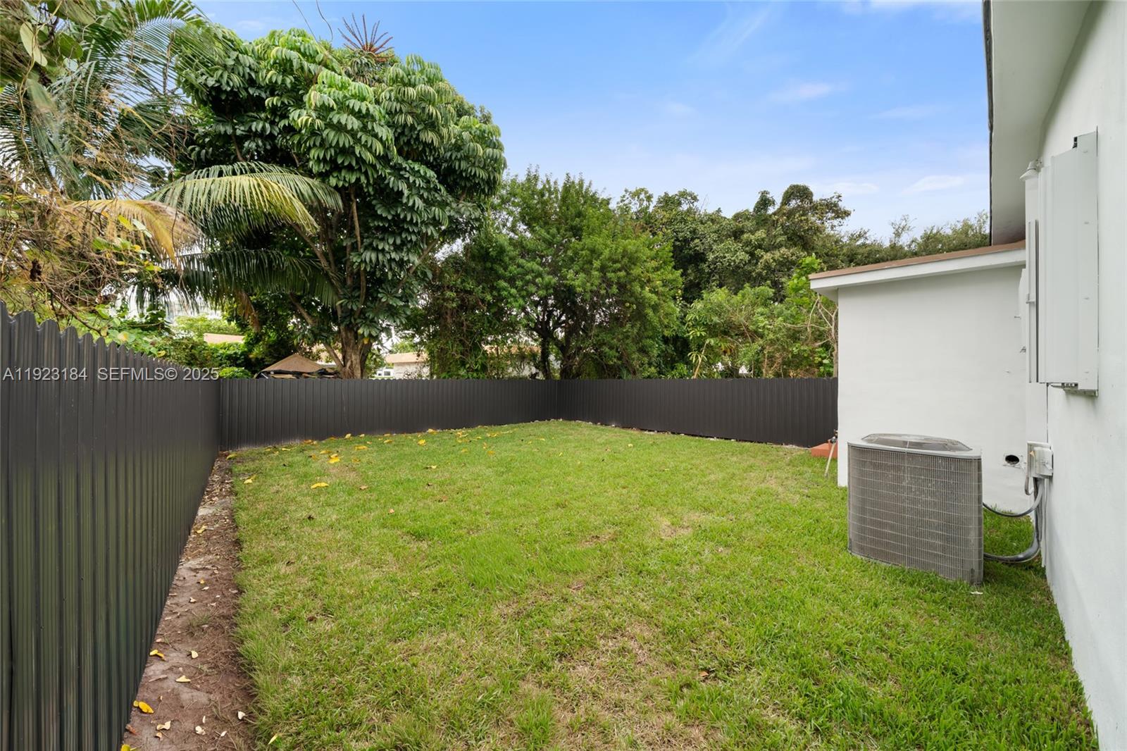 2350 Northwest 56th Street Miami, FL 33142 - Photo 21 of 22 a backyard of a house with lots of green space