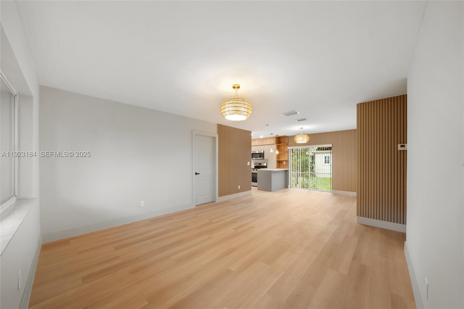 2350 Northwest 56th Street Miami, FL 33142 - Photo 6 of 22 a view of a room with cabinet and windows