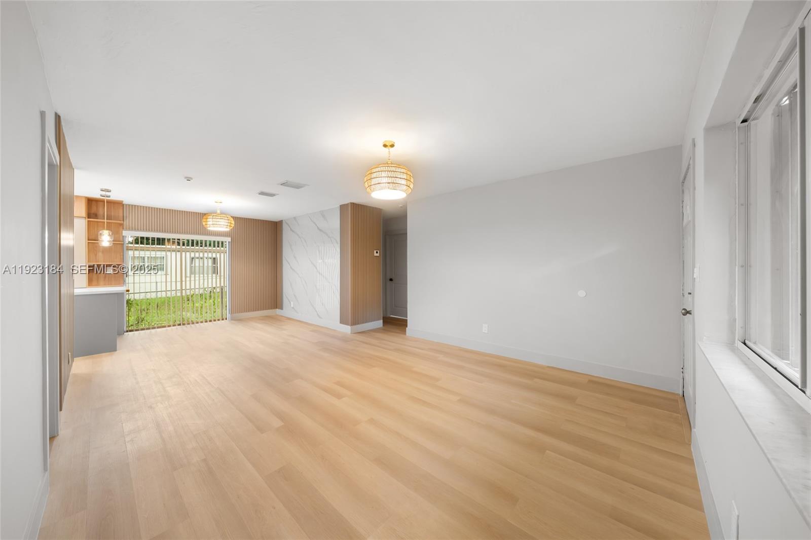 2350 Northwest 56th Street Miami, FL 33142 - Photo 7 of 22 a view of an empty room with a window