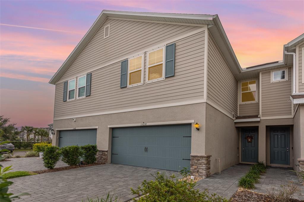11638 Woodleaf Drive Bradenton, FL 34211 - Photo 1 of 1 a front view of a house with garden