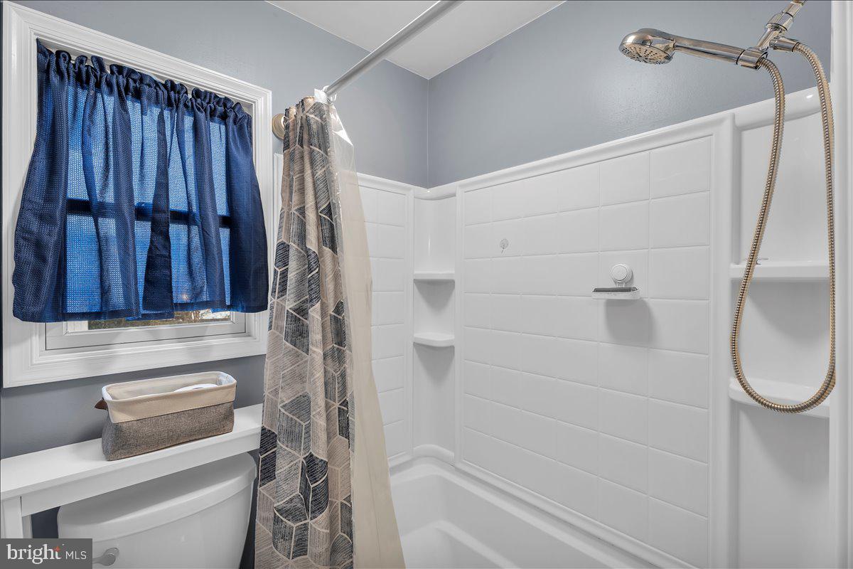 20 West Laurel Road Stratford, NJ 08084 - Photo 13 of 24 a bathroom with a shower toilet and tub