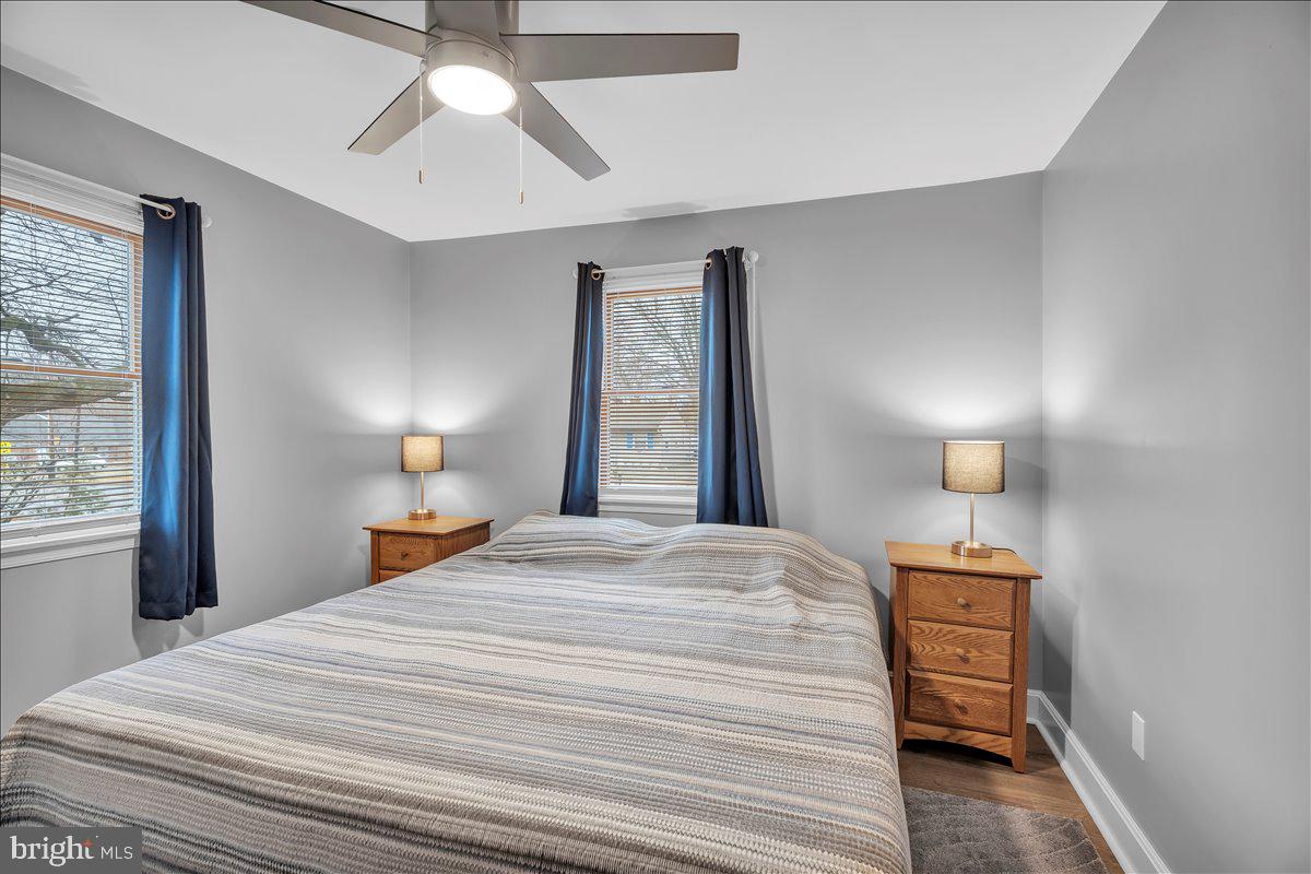 20 West Laurel Road Stratford, NJ 08084 - Photo 14 of 24 a bedroom with a bed and a lamp