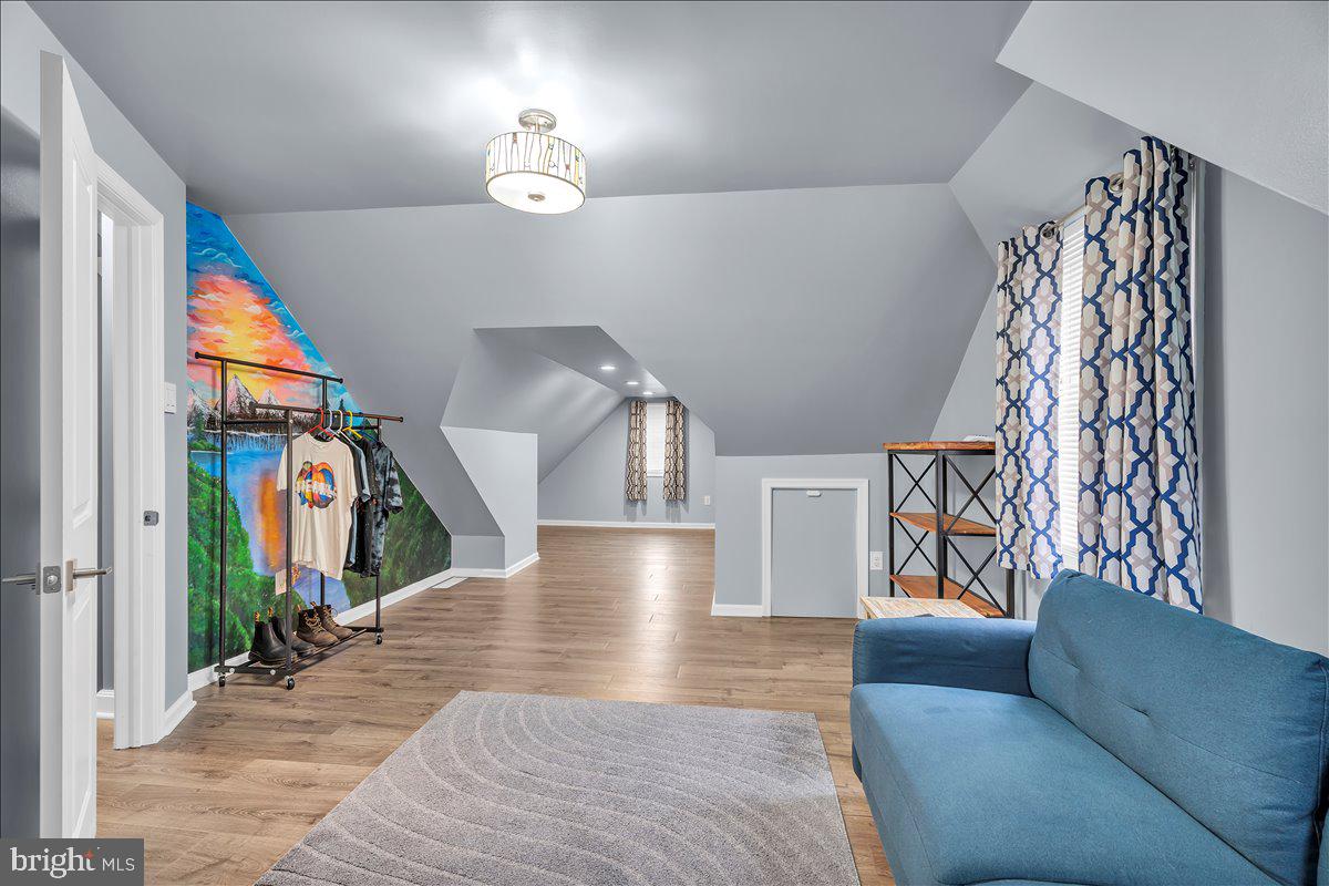 20 West Laurel Road Stratford, NJ 08084 - Photo 16 of 24 a living room with furniture and stairs