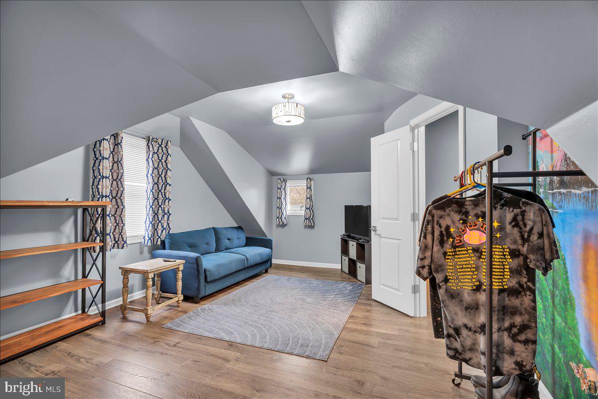 20 West Laurel Road Stratford, NJ 08084 - Photo 17 of 24 a living room with furniture and a walk in closet