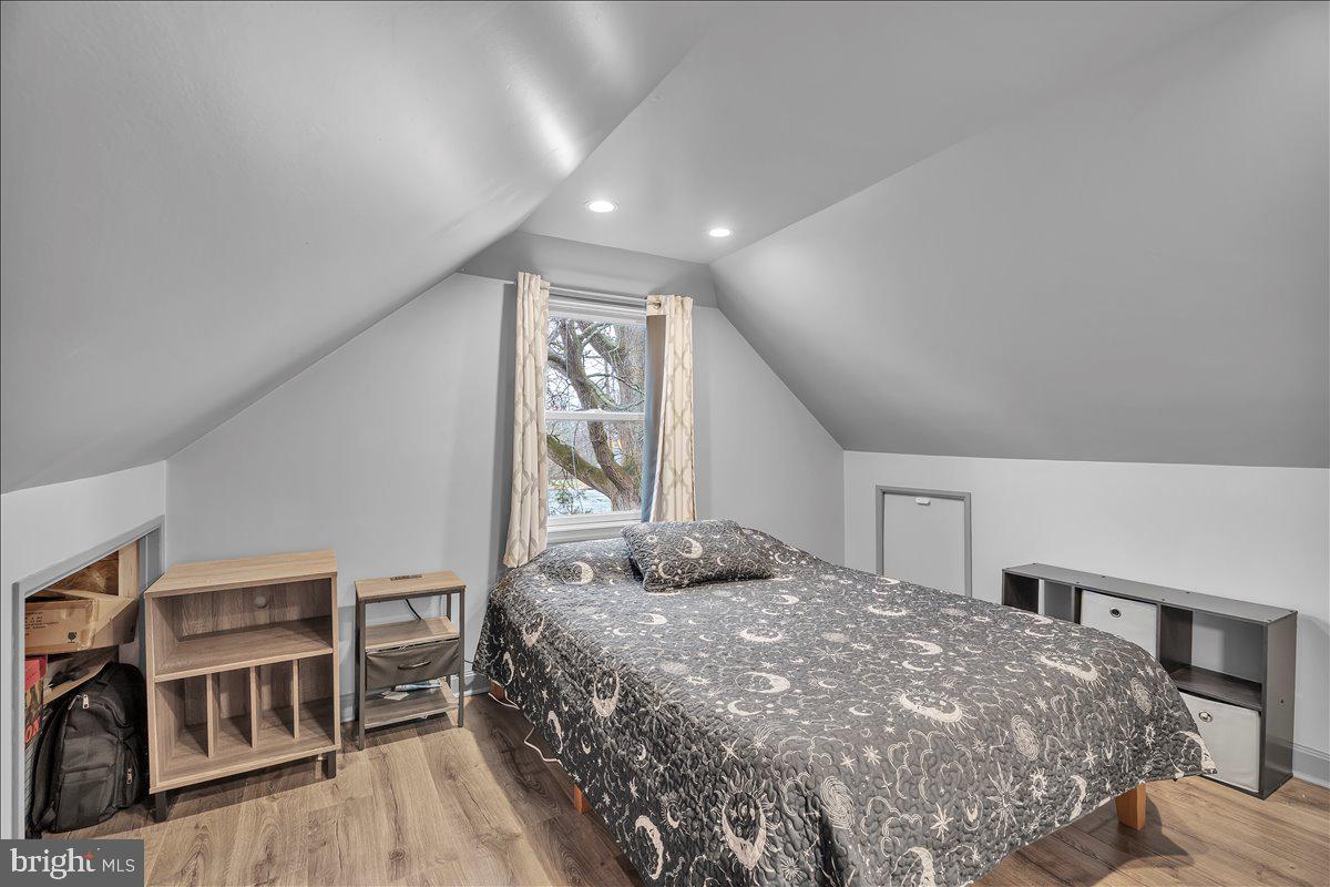 20 West Laurel Road Stratford, NJ 08084 - Photo 19 of 24 a bedroom with a bed and a book shelf