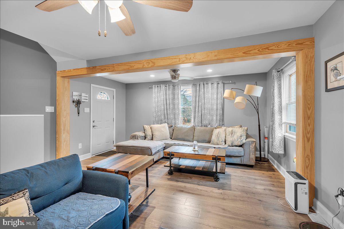 20 West Laurel Road Stratford, NJ 08084 - Photo 4 of 24 a living room with furniture and a large window