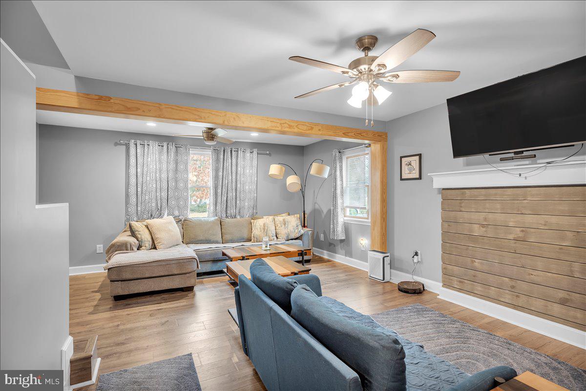 20 West Laurel Road Stratford, NJ 08084 - Photo 5 of 24 a living room with furniture and a flat screen tv