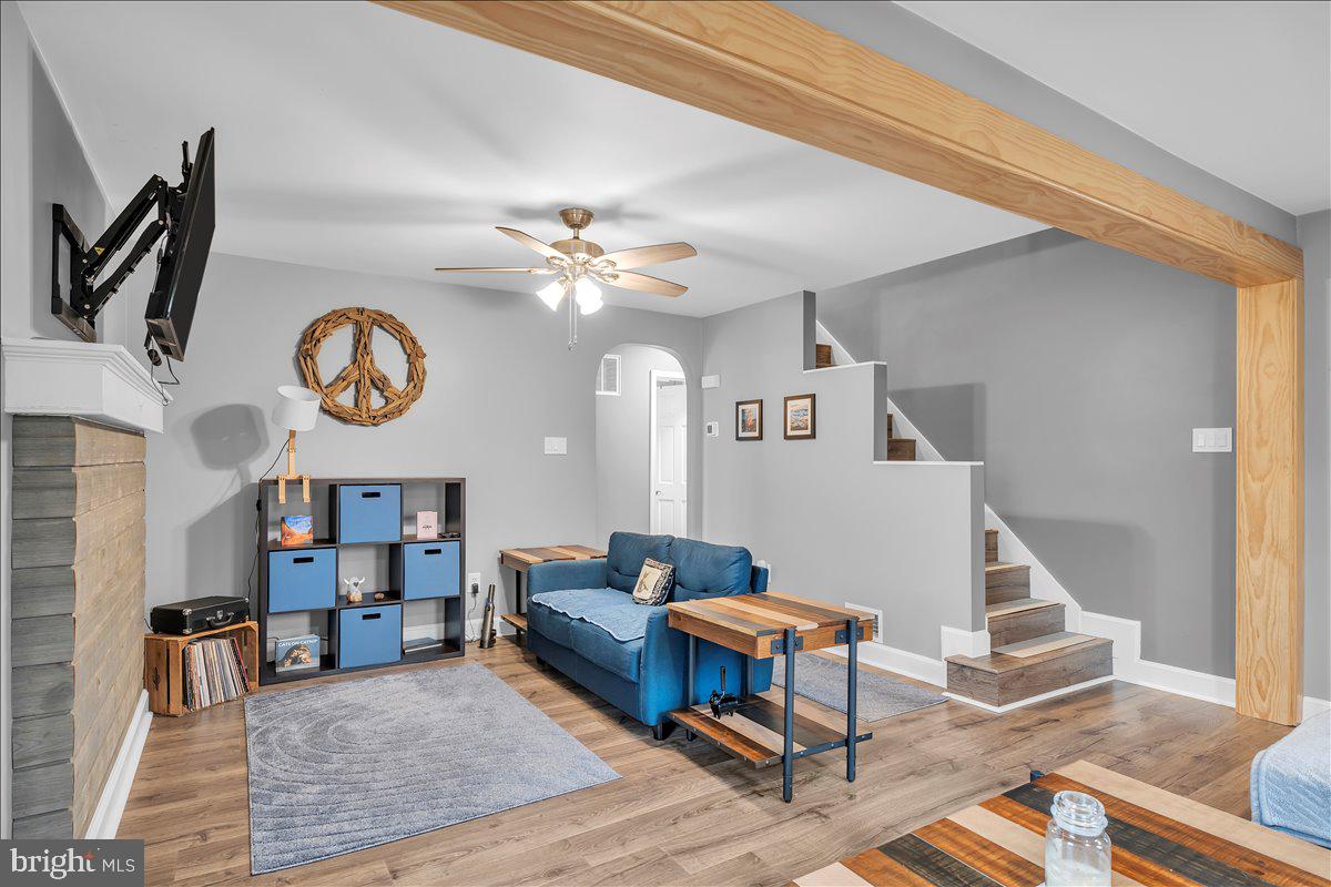 20 West Laurel Road Stratford, NJ 08084 - Photo 6 of 24 a living room with furniture and a chandelier